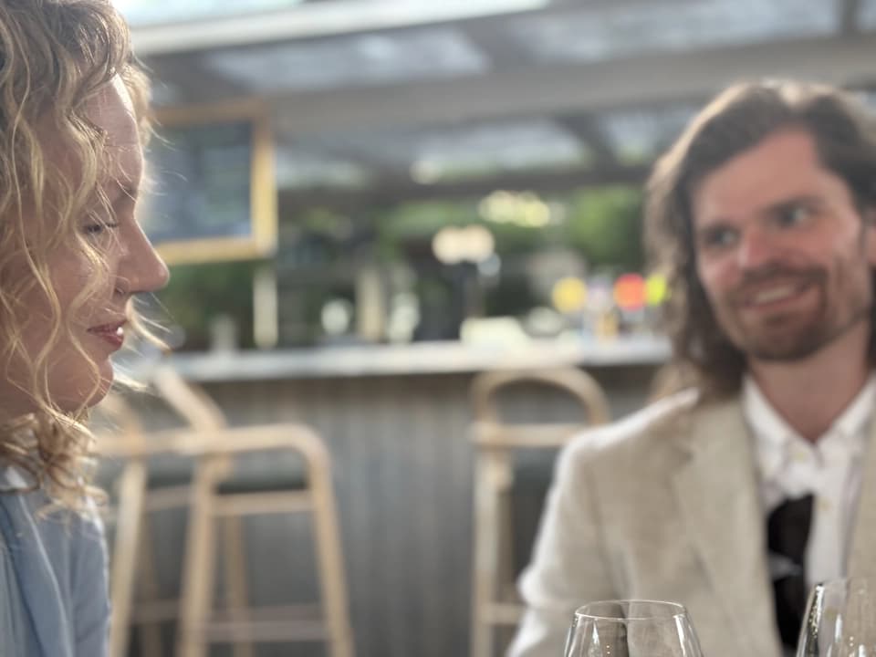 Netler ladies holding paintings during team building