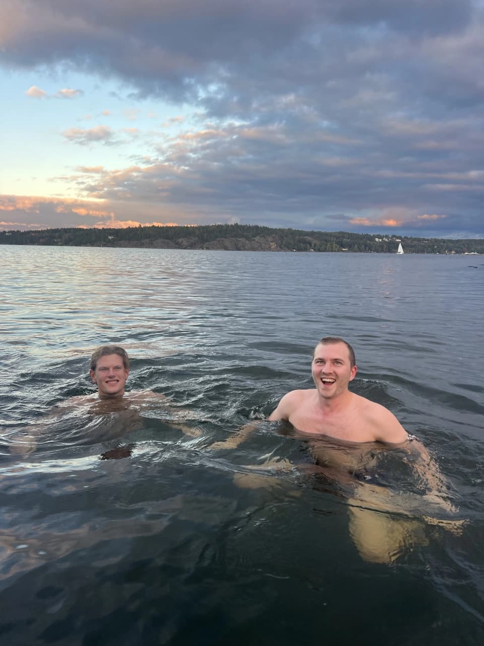 Netler consultants socializing around a table