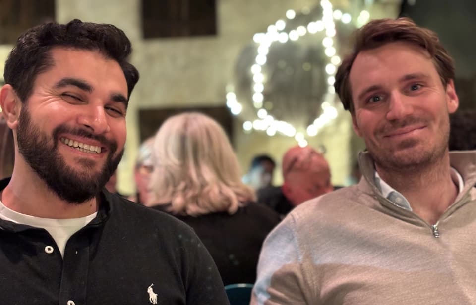 Netler consultants working outside with laptops